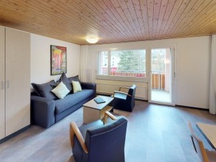 Wohnzimmer mit Essbereich - Reka-Feriendorf Bergün