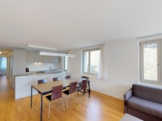 Living room with dining area - Reka Holiday Village Blatten