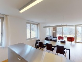 Living room with dining area - Reka Holiday Village Blatten