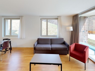 Living room with dining area - Reka Holiday Village Blatten