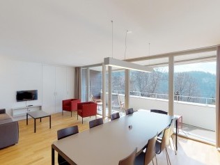 Living room with dining area - Reka Holiday Village Blatten