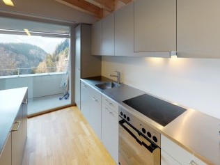 Kitchen with dining area - Reka Holiday Village Blatten