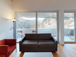 Living room with dining area - Reka Holiday Village Blatten