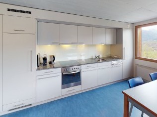 Kitchen with dining area - Reka Holiday Village Disentis