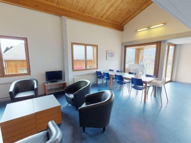 Living room with dining area - Reka Holiday Village Disentis