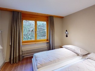 Schlafzimmer - Reka-Feriendorf Hasliberg