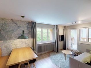 Wohnzimmer mit Essbereich - Reka-Feriendorf Zinal