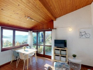 Wohnzimmer mit Essbereich - Reka-Ferienanlage Brissago