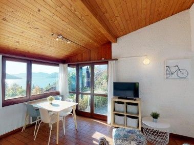 Wohnzimmer mit Essbereich - Reka-Ferienanlage Brissago