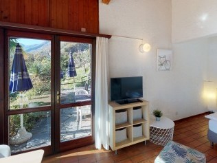 Wohnzimmer mit Essbereich - Reka-Ferienanlage Brissago