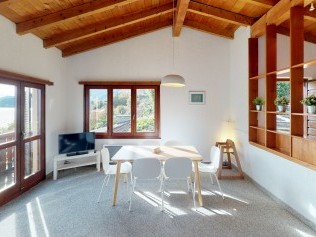 Wohnzimmer mit Essbereich - Reka-Ferienanlage Brissago