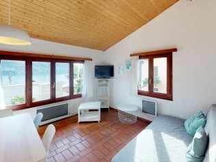Wohnzimmer mit Essbereich - Reka-Ferienanlage Brissago