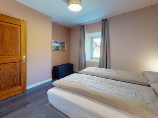 Schlafzimmer - Reka-Ferienanlage Chesa Engadina Madulain