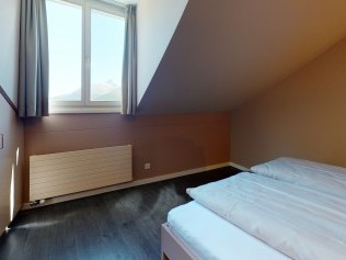 Schlafzimmer - Reka-Ferienanlage Chesa Engadina Madulain