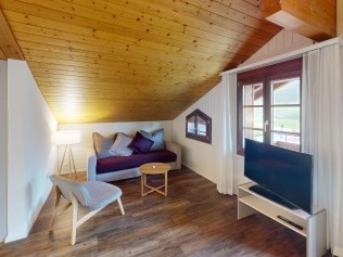 Wohnzimmer mit Essbereich - Reka-Ferienanlage Rougemont