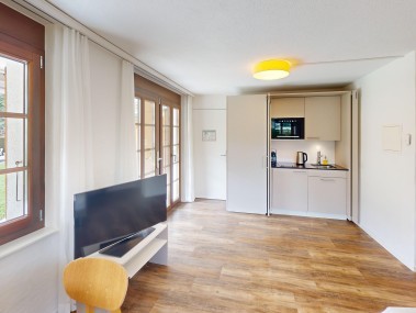 Wohnzimmer mit Essbereich - Reka-Ferienanlage Rougemont