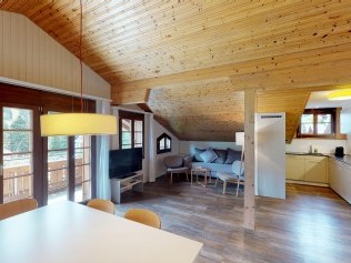 Wohnzimmer mit Essbereich - Reka-Ferienanlage Rougemont