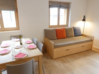 Wohnzimmer mit Essbereich - T-Resort