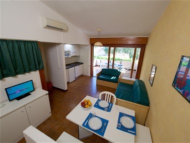 Wohnzimmer mit Essbereich - Residence Solemaremma