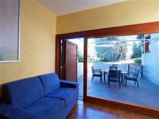 Wohnzimmer mit Essbereich - Residence Solemaremma