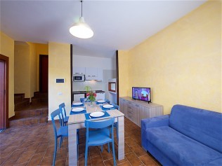 Wohnzimmer mit Essbereich - Residence Solemaremma
